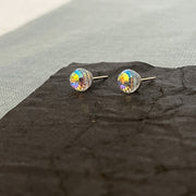 Small 8mm Swarovski AB "mini disco ball" stud earrings close up to show scale and high-shimmer, rainbow sparkle.